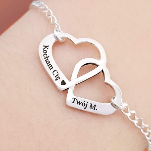 Srebrna Bransoletka dwa przeplatane Serca z Grawerem.png